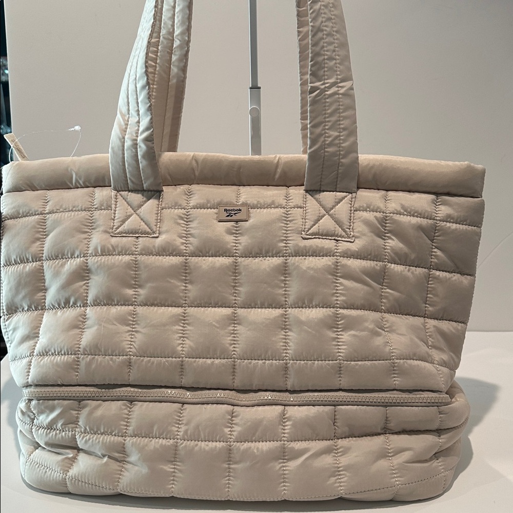 Reebok Ellie Dual Compartment Nylon Tote with Suitcase Loop on the back.